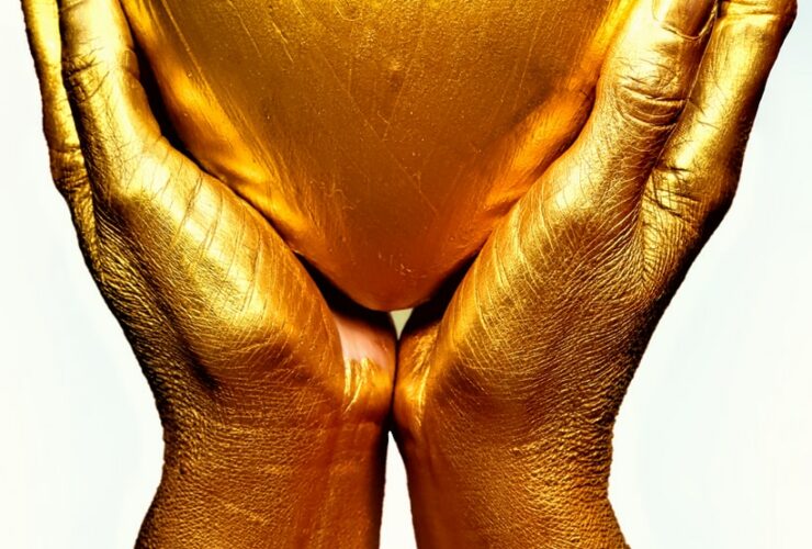 persons hand on white surface