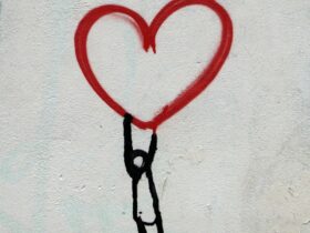 red heart and man hanging drawing