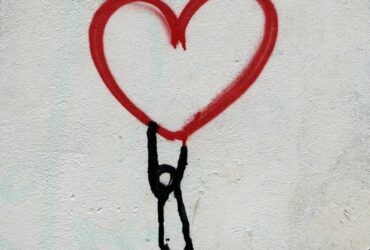 red heart and man hanging drawing