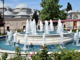 fountain in front of brown building