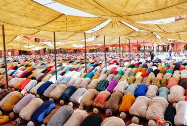 people bowing down inside canopy during day