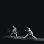 two people fencing