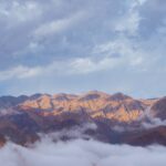 brown mountains under white clouds during daytime