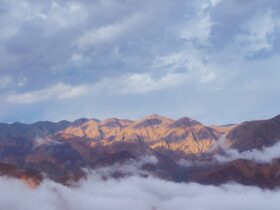 brown mountains under white clouds during daytime