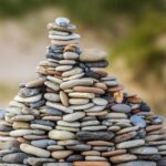 selective focus photography of stack of stones