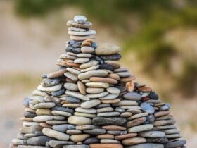 selective focus photography of stack of stones