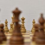 brown chess piece on white surface