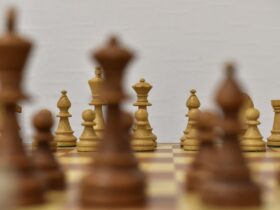 brown chess piece on white surface