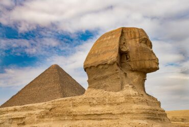 brown concrete statue under blue sky during daytime