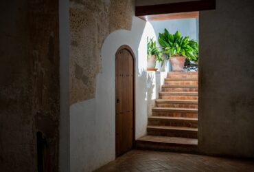 white building showing closed door