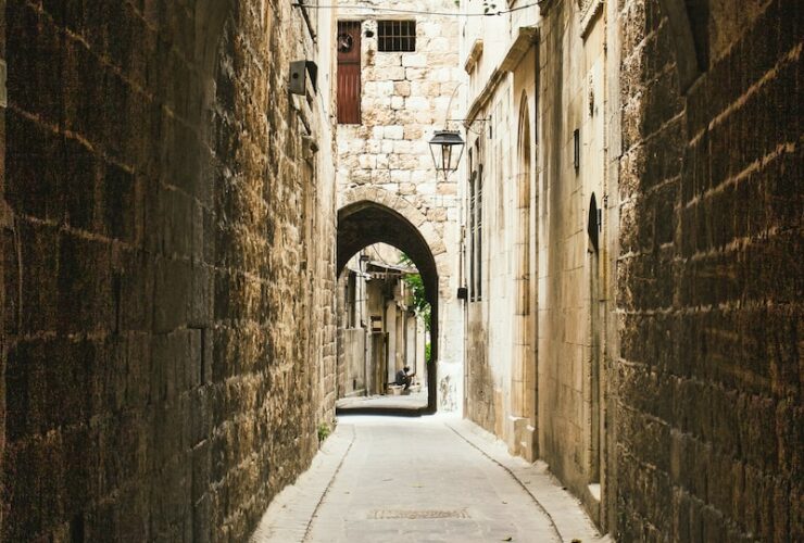 person walking on gray concrete pathway during daytime
