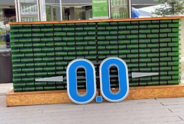 blue and white signage on brown brick wall
