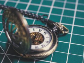 silver-colored pocket watch