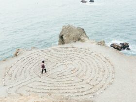 person walking on beach during daytime