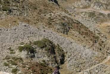 people on green grass covered mountain during daytime