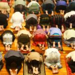 a group of people laying on a rug in a room