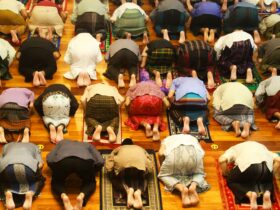 a group of people laying on a rug in a room
