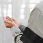 a man holding his hands together