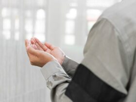 a man holding his hands together