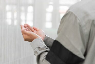 a man holding his hands together