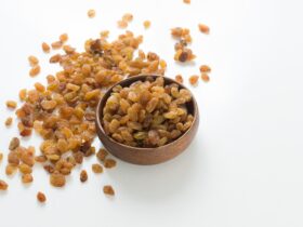 brown and white nuts on brown wooden bowl