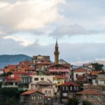 a city with a clock tower on top of it