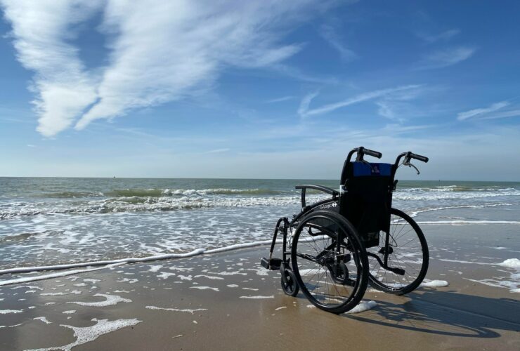 black and gray wheelchair on beach during daytime