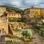 brown buildings under cloudy sky
