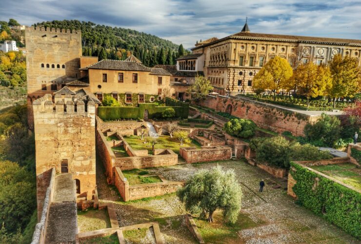 brown buildings under cloudy sky
