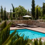 white umbrella by the swimming pool