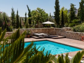 white umbrella by the swimming pool