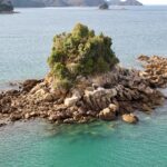 a small island in the middle of a body of water