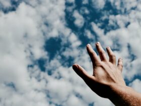 person hand reaching for the sky