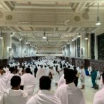 a group of people in white robes