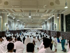 a group of people in white robes