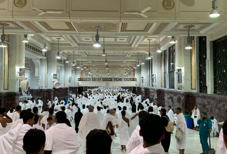 a group of people in white robes
