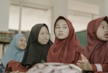 2 women in red hijab