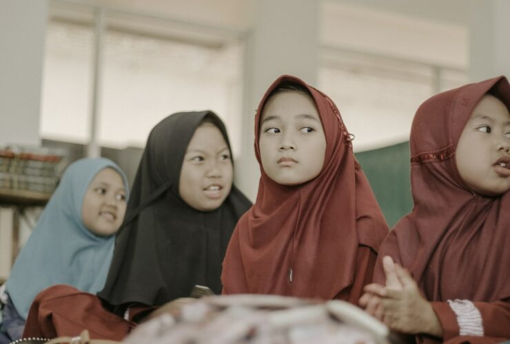 2 women in red hijab