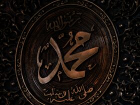 a close up of a metal plate with arabic writing