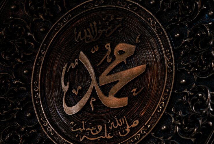 a close up of a metal plate with arabic writing