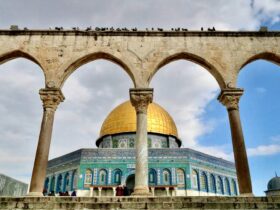 brown and green dome building under white clouds during daytime