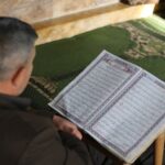 Man Reading Quran