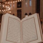 Islam scripture in Arabic language in person hand