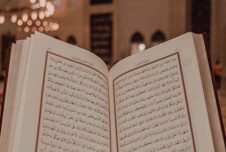 Islam scripture in Arabic language in person hand