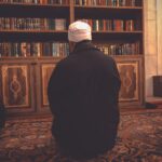 Man while Praying in Library