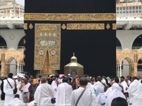 People in White Robe Standing the Stage