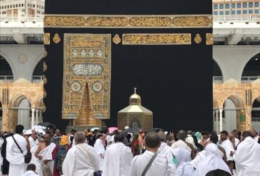 People in White Robe Standing the Stage