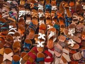 a bunch of shoes that are laying on the ground