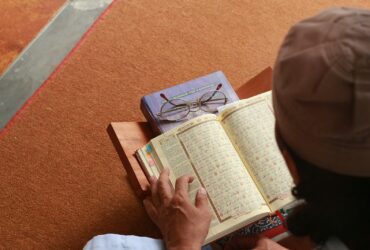 a person reading a book on the floor
