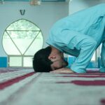 a person lying on a bed